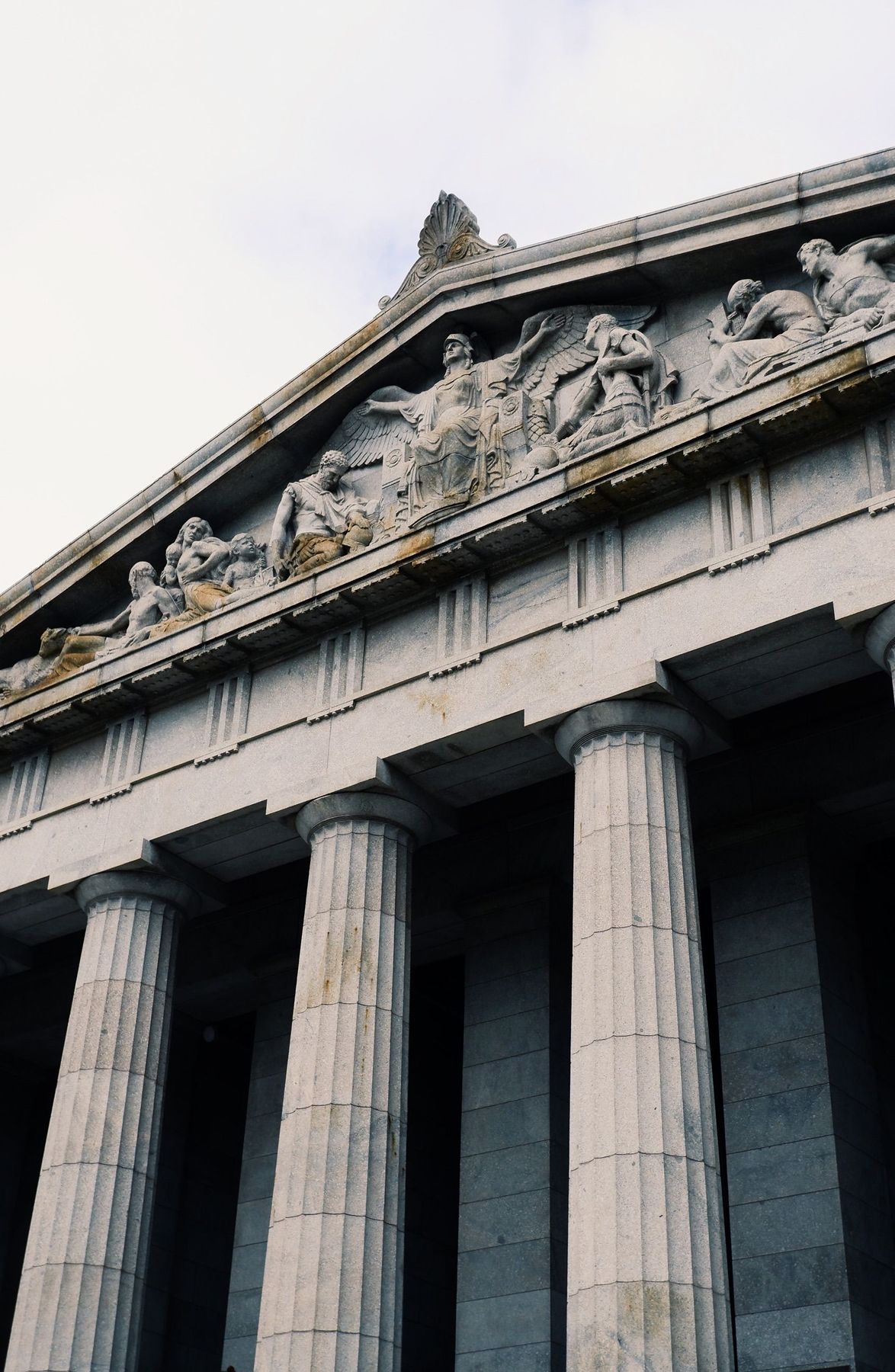 Sculpted pediment and fluted columns of a classical government building